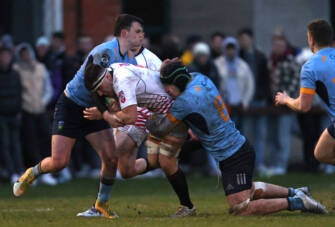 Diarmuid McCormack is tackled by David Ryan and James Culhane 1/4/2022