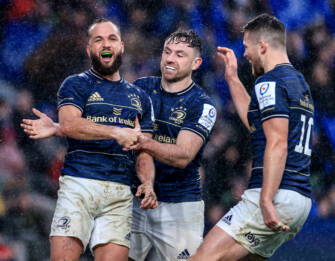 Jamison Gibson Park celebrates with Hugo Keenan and Ross Byrne after scoring 1/4/2023