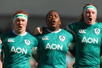 Niamh O'Dowd, Linda Djougang and Ruth Campbell sing the national anthem ahead of the game 30/3/2025