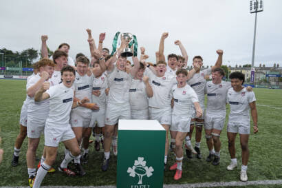 Nathan Noble lifts the cup and celebrates with his team 1/9/2024
