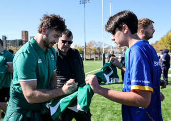 Ireland captain Caelan Doris signs an autograph for a young supporter in Chicago. Ireland captain Caelan Doris signs an autograph for a young supporter in Chicago.