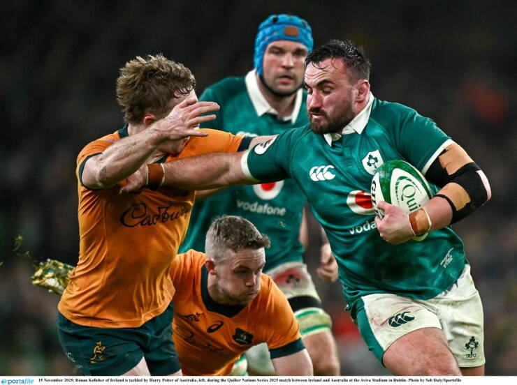 15 November 2025; Rónan Kelleher of Ireland is tackled by Harry Potter of Australia, left, during the Quilter Nations Series 2025 match between Ireland and Australia at the Aviva Stadium in Dublin. Photo by Seb Daly/Sportsfile