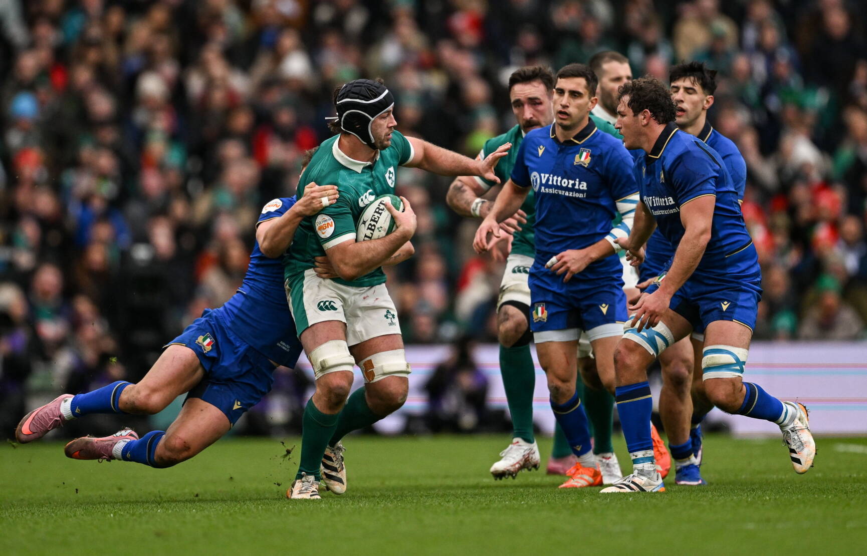 14 February 2026; Caelan Doris of Ireland is tackled by Leonardo Marin of Italy during the Guinness 6 Nations Rugby Championship match between Ireland and Italy at the Aviva Stadium in Dublin. Photo by Ramsey Cardy/Sportsfile
