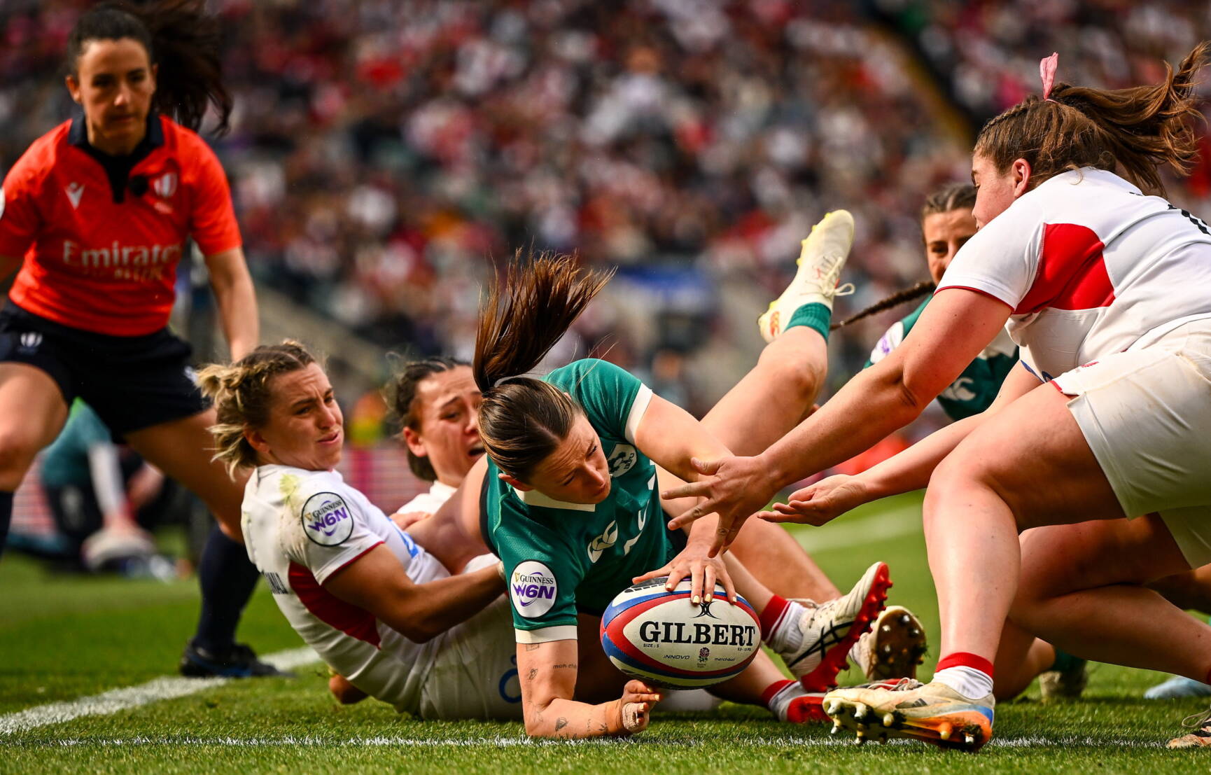 Anna McGann reaches out to score a try against England