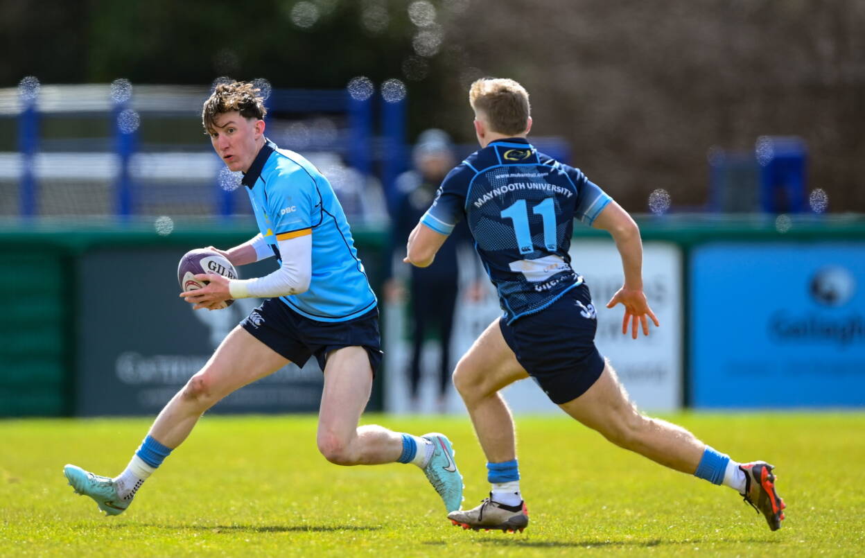 UCD full-back Brian O'Flaherty in action against MU Barnhall's Ivor Fenton