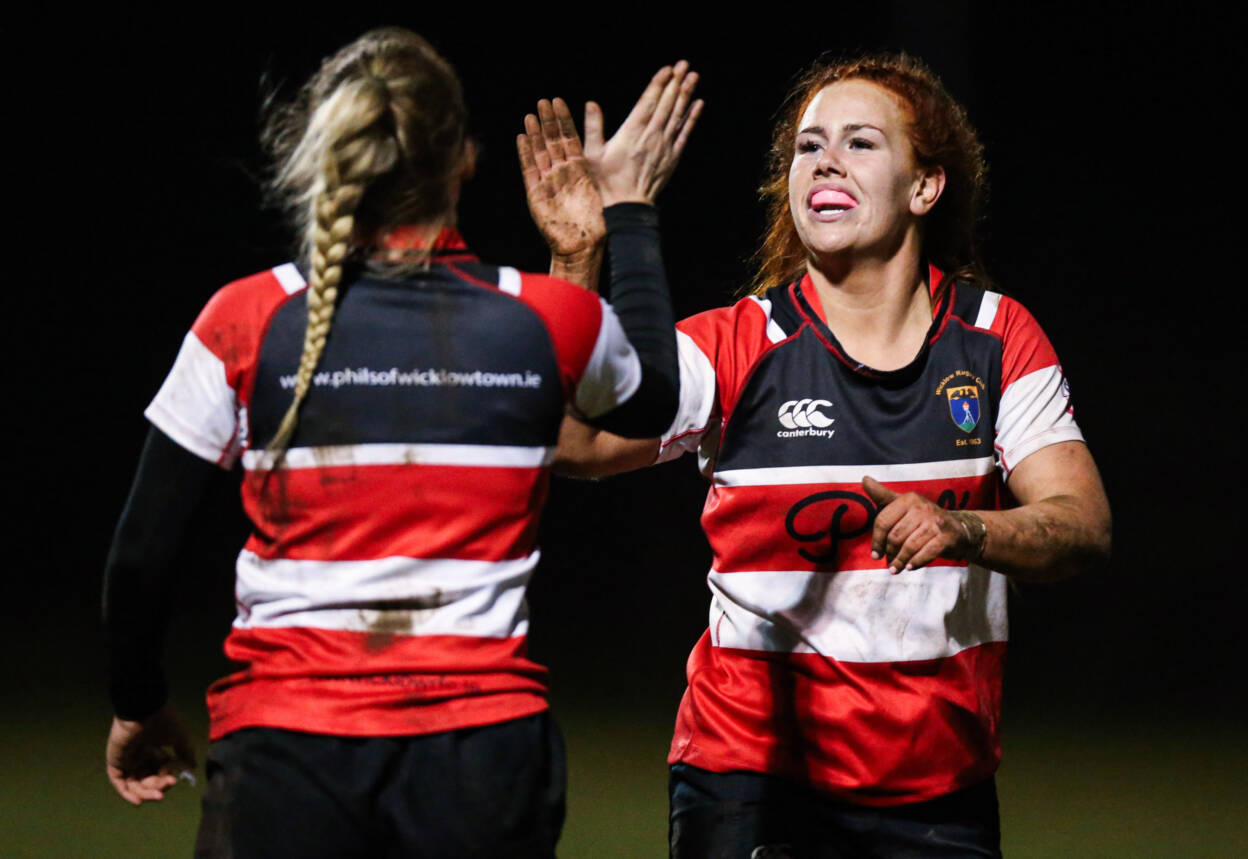 Wicklow's Caoimhe Molloy celebrates a try with Erin McConnell