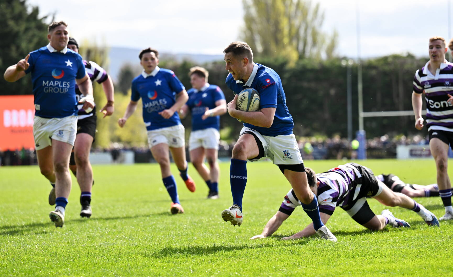 St. Mary's College captain Conor Dean breaks through to score a try against Terenure College