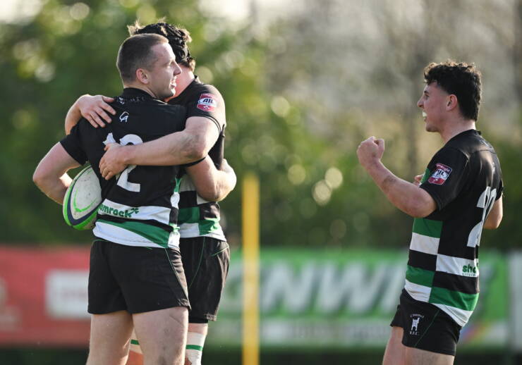 Clonmel captain Henry Buttimer is congratulated after scoring a try