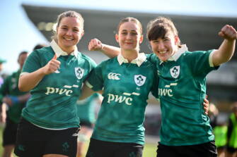 18 April 2026; Ireland players, from left, Sarah Delaney, Ellie O'Sullivan-Sexton and Niamh Gallagher celebrate after the Women's U21 Six Nations Series match between Ireland and Italy at Dexcom Stadium in Galway. Photo by Shauna Clinton/Sportsfile