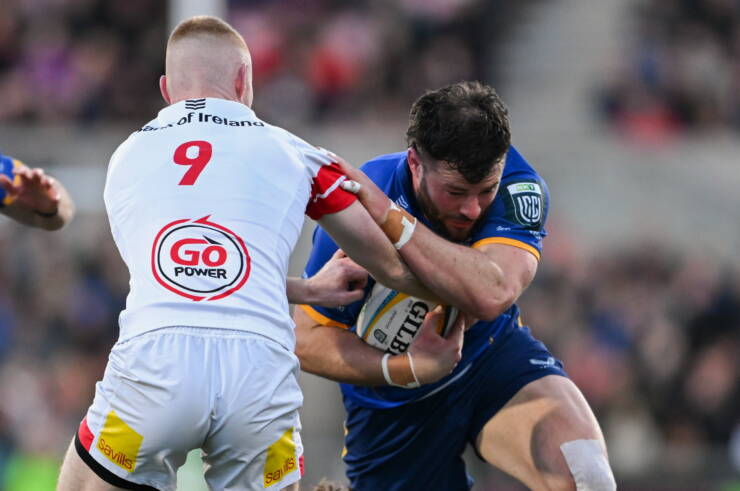 17 April 2026; Robbie Henshaw of Leinster is tackled by Nathan Doak of Ulster during the United Rugby Championship match between Ulster and Leinster at Affidea Stadium in Belfast. Photo by Ramsey Cardy/Sportsfile