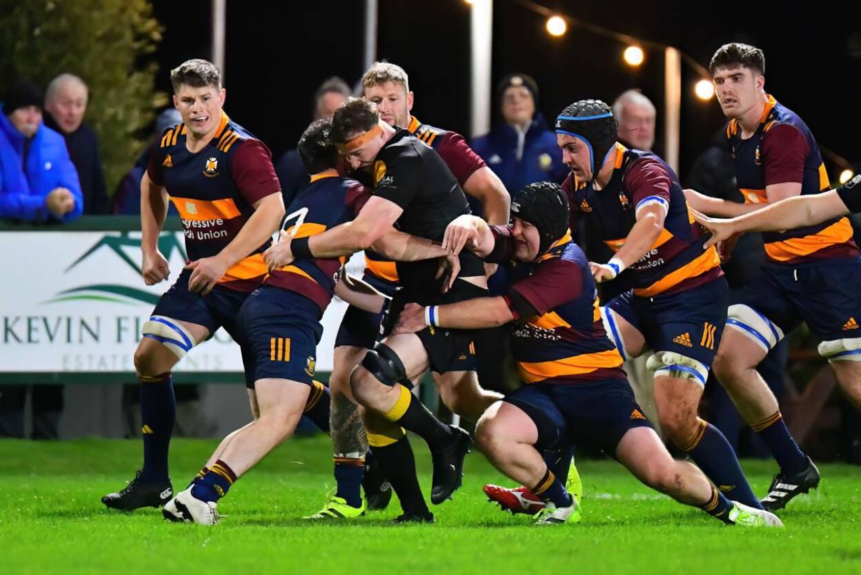 Malahide captain Marc Kelly makes a carry