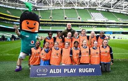 22 April 2026; Maynooth Presentation Girls School, Kildare, with Aldi ambassador Paul O'Connell and mascot Kevin the Carrot, during the Aldi Play Rugby Festival at the Aviva Stadium in Dublin. Photo by Seb Daly/Sportsfile