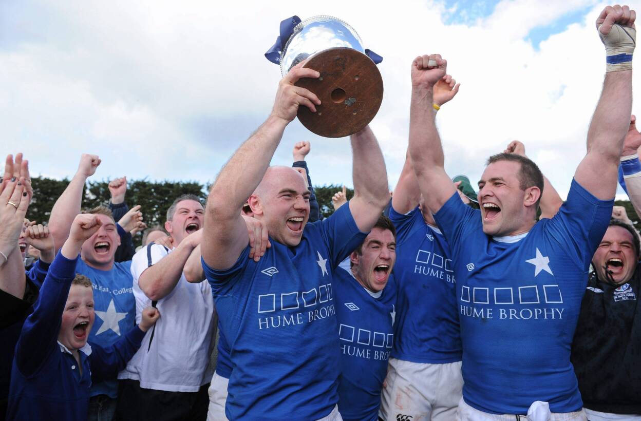 Captain Hugh Hogan lifts the trophy as St. Mary's College are crowned Division 1A champions