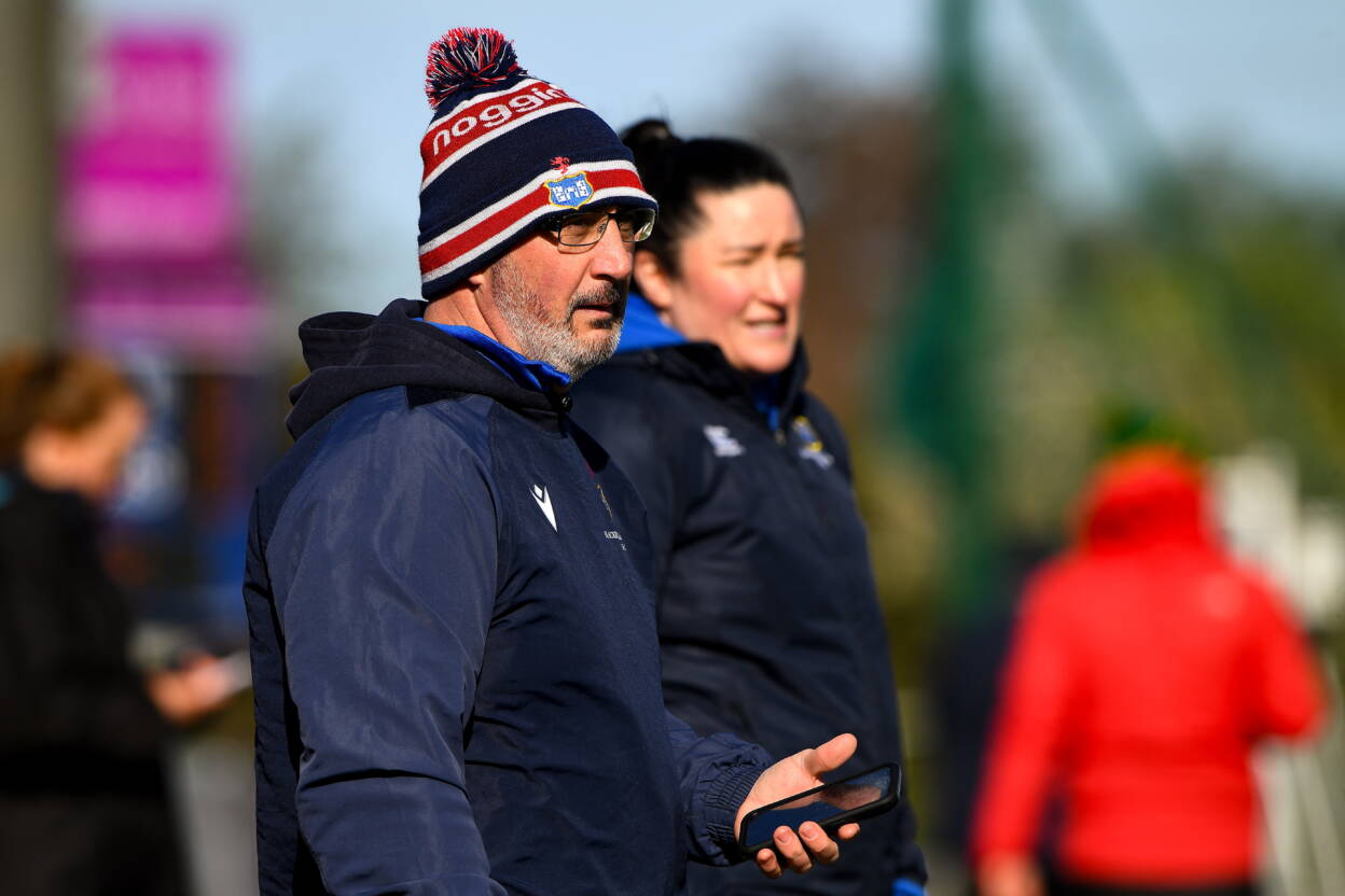 Blackrock College head coach Niall Neville alongside Hannah O'Connor