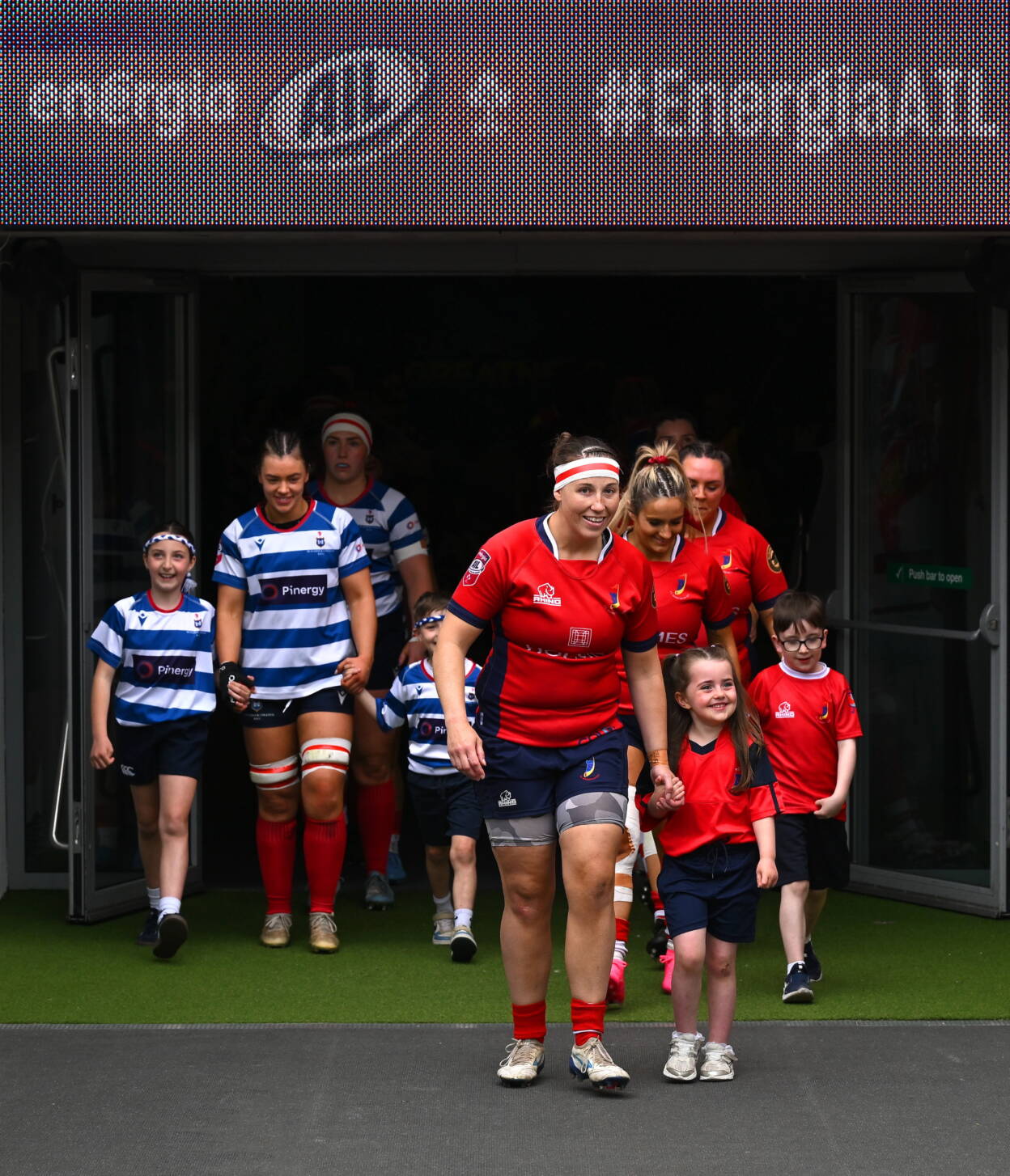 Maeve Óg O'Leary and Chloe Pearse lead the teams out