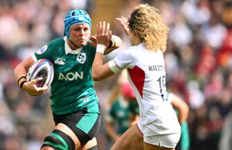 Ireland back rower Brittany Hogan takes on England's Ellie Kildunne